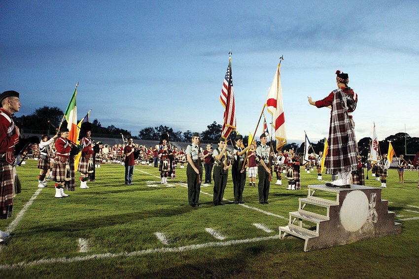 Current members and alumni of the Kiltie band perform during pre-game festivities at Riverview's homecoming game.