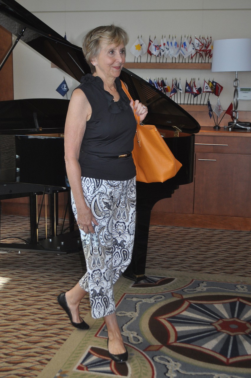 Anne Wood struts through the Sarasota Yacht Club dining room
