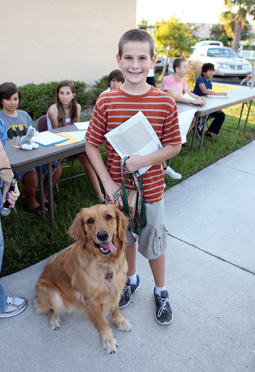 RJ Egan with his dog, Maggie, 3 Â½, won for biggest animal at the pet blessing.
