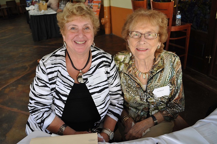 Jean Muccini, event organizer, and Pat Mitchell, who served on the planning committee, greeted guests.