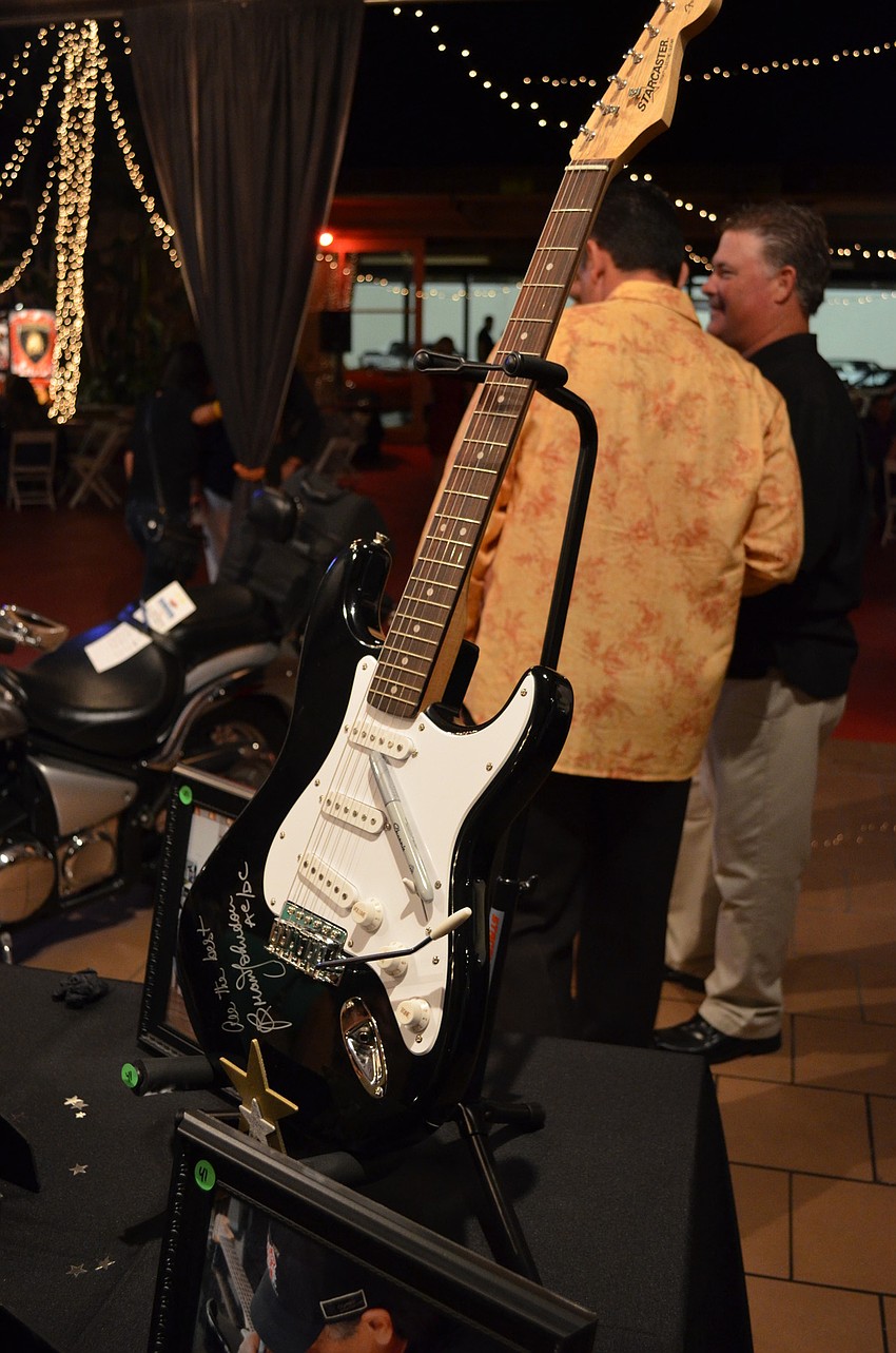 The event boast a large amount of auction items including a motorcycle that went for $4,000 and autographed Brian Johnson guitar that went for $2,000.