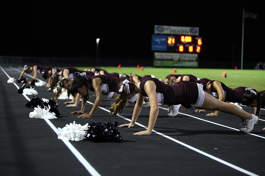 The Riverview cheerleaders do 21 pushups to match Riverviewâ€™s score Friday, Sept. 21 during the Braden River versus Riverview game at Braden River.