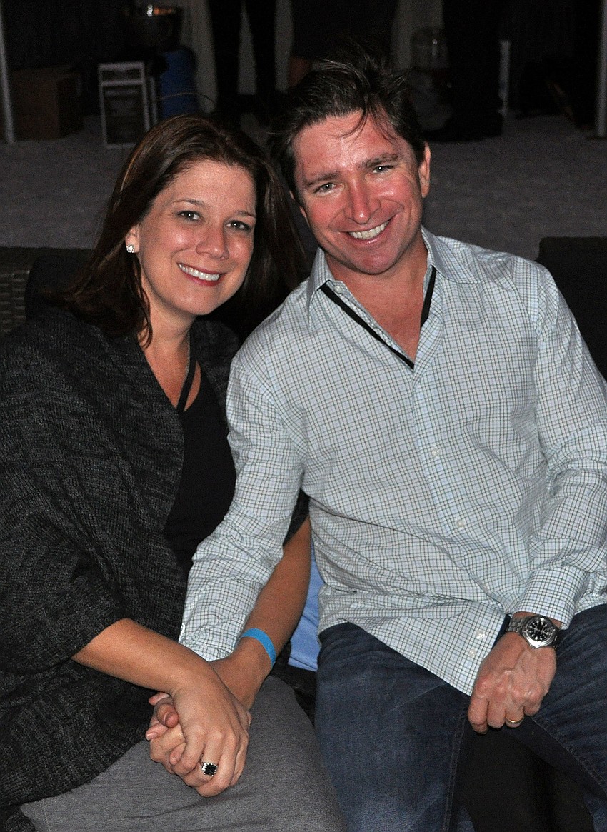 Amy and Jamie Wood got comfortable on a couch on the beach.