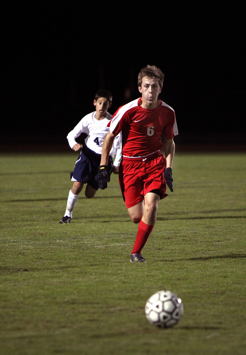 ODAâ€™s Trevor Gorjil, No. 4, and Cardinal Mooneyâ€™s Mitch Gannon, No. 6, both chase after the ball.
