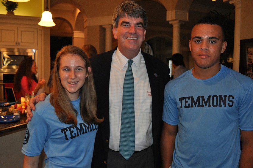Out-of-Door Academy Head of School David Mahler, center, stands with Taylor Emmons Scholarship Fund recipients Sierra VanSuch, left, and Desmond Lindsay, right.
