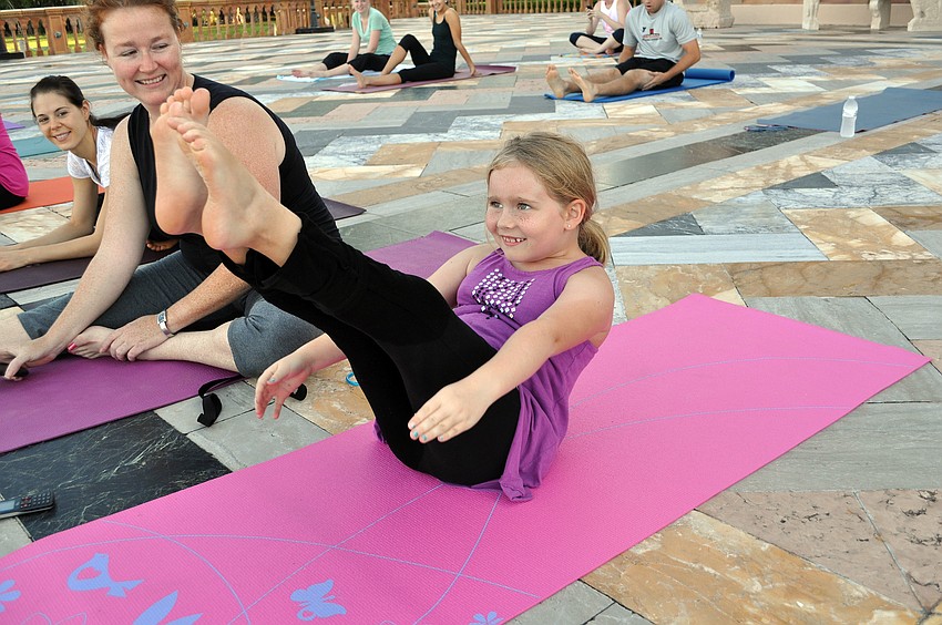 Ella Queen, 7, shows off her boat pose.