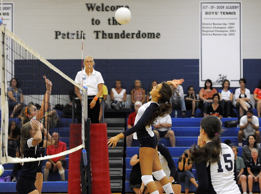 ODAâ€™s Gabriella Costa attempts to hit the ball past a pair of Bradenton Christian blockers.