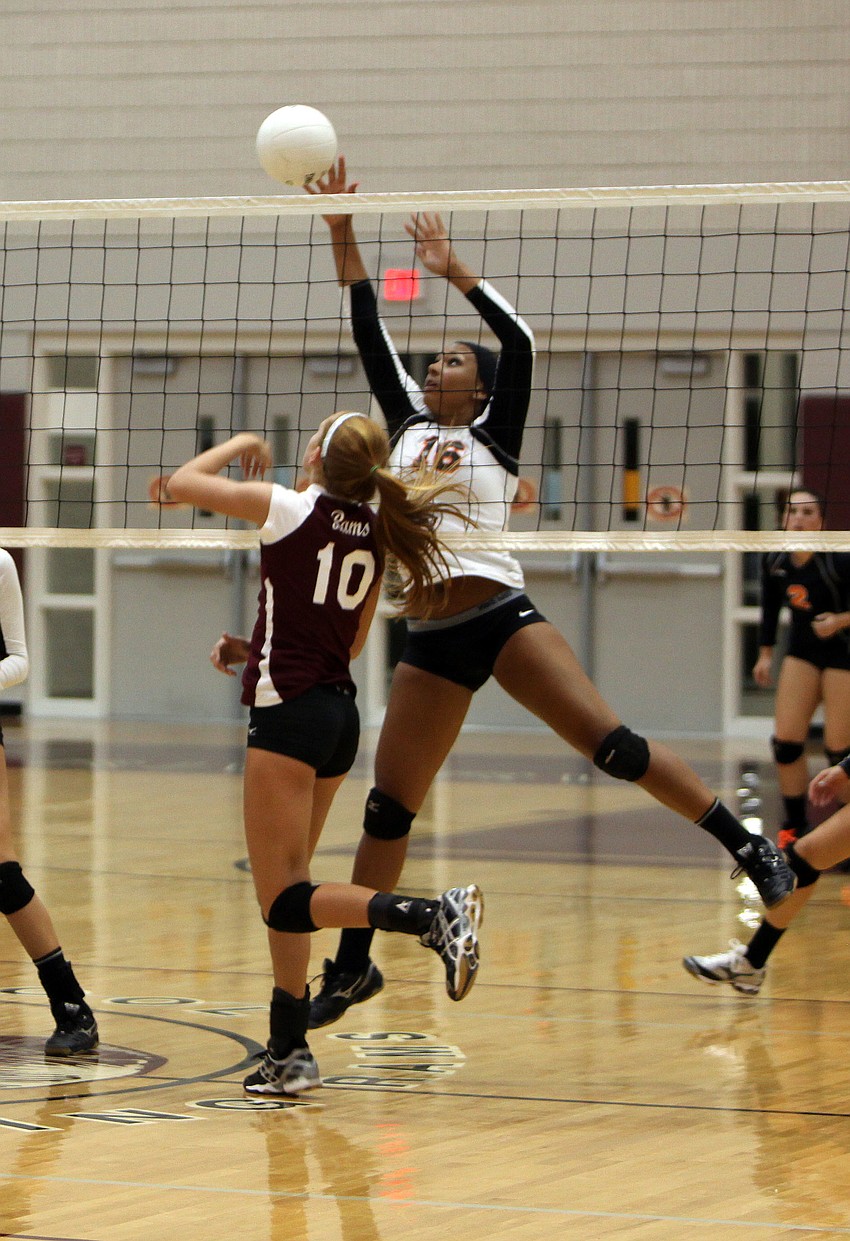 Ashley Allmer. No. 10, prepares to try and stop Alexis Singleton, No. 16, from getting the ball over the net Monday, Sept. 17 inside Riverview High Schoolâ€™s Gymnasium.