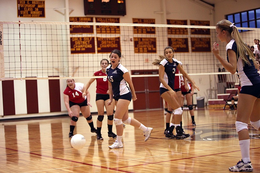 Both Cardinal Mooney and the Out-of-Door Academy varsity volleyball teams watch to see if the ball is going out during their game Thursday, Sept. 20 at Cardinal Mooney.