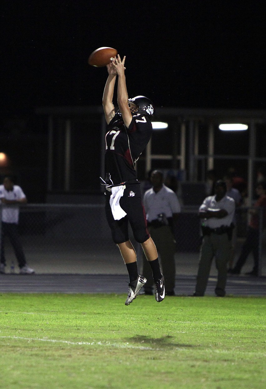 Zac Dâ€™Urso, No. 17, jumps up to catch the ball.