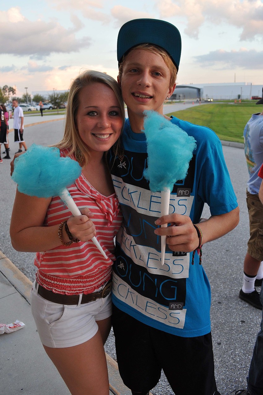 Brianna Douglas and J.C. Hooper enjoyed cotton candy at the school bonfire Sept. 27.