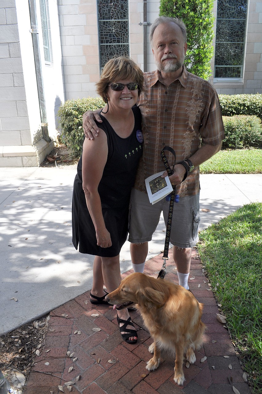 Teresa Carafelli and Fred Frederick with their golden retriever, Dixie.