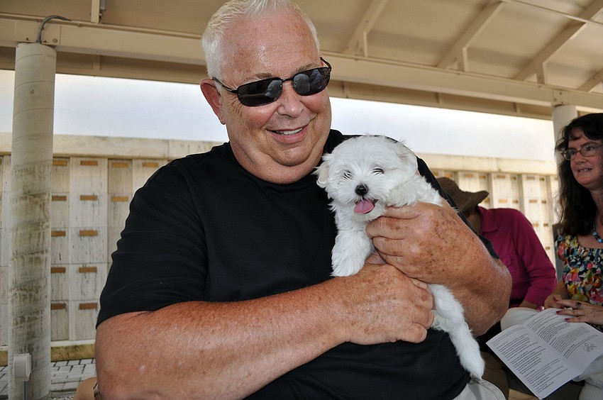 Will Brown with his 9-week-old puppy, Paci.