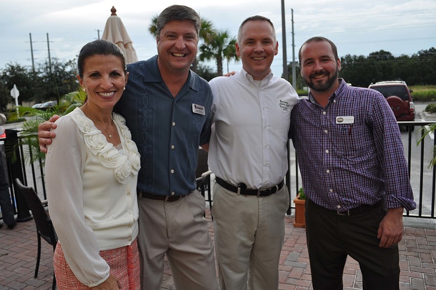Violeta Huesman with Truman's owner John Brocke, Patrick Wright and Truman's co-owner Jason Seelbach.