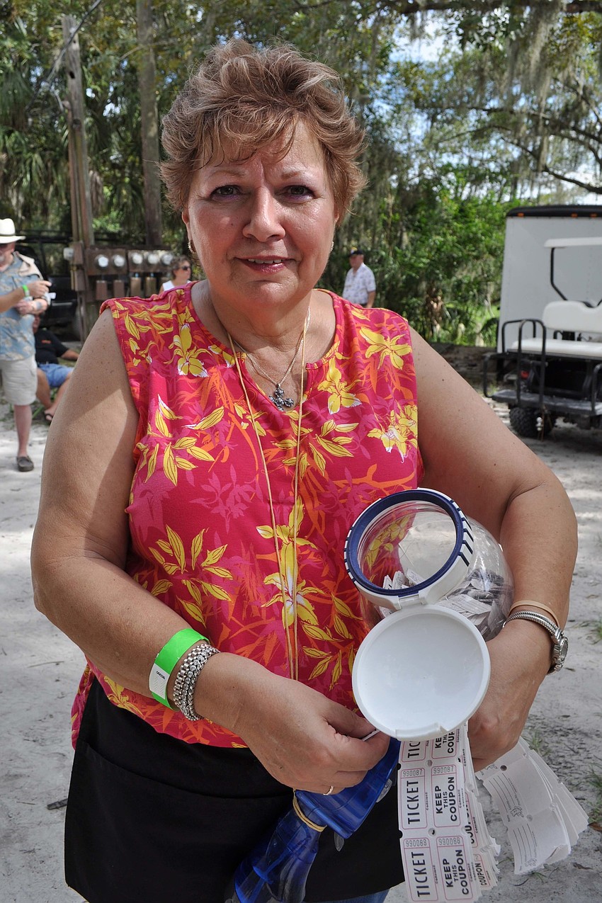 Flo Harns, of the Southwest Florida Bluegrass Association, sold raffle tickets.