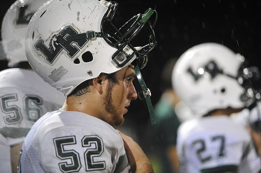 Junior defensive lineman Mason Hobbs looks on as the Mustangs offense takes the field.