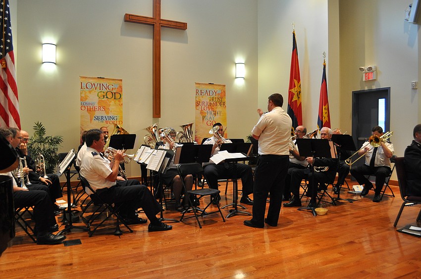 The divisional band plays during the offering