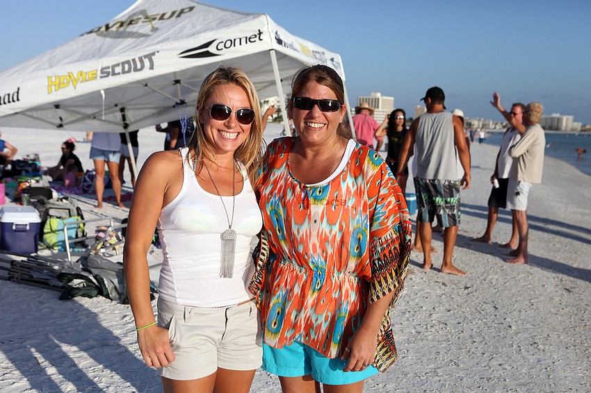 Dani DiBattista, a bartender at Geckoâ€™s and volunteer at the shelter, and Amy Leithauser, manager of Geckoâ€™s at The Landings.