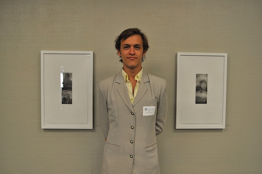 Stefan Batista stands in front of his work.