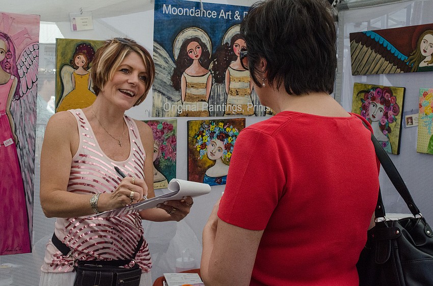 Tonya Smith spoke with festivalgoers about her artwork from Moondance Art & Design Company.