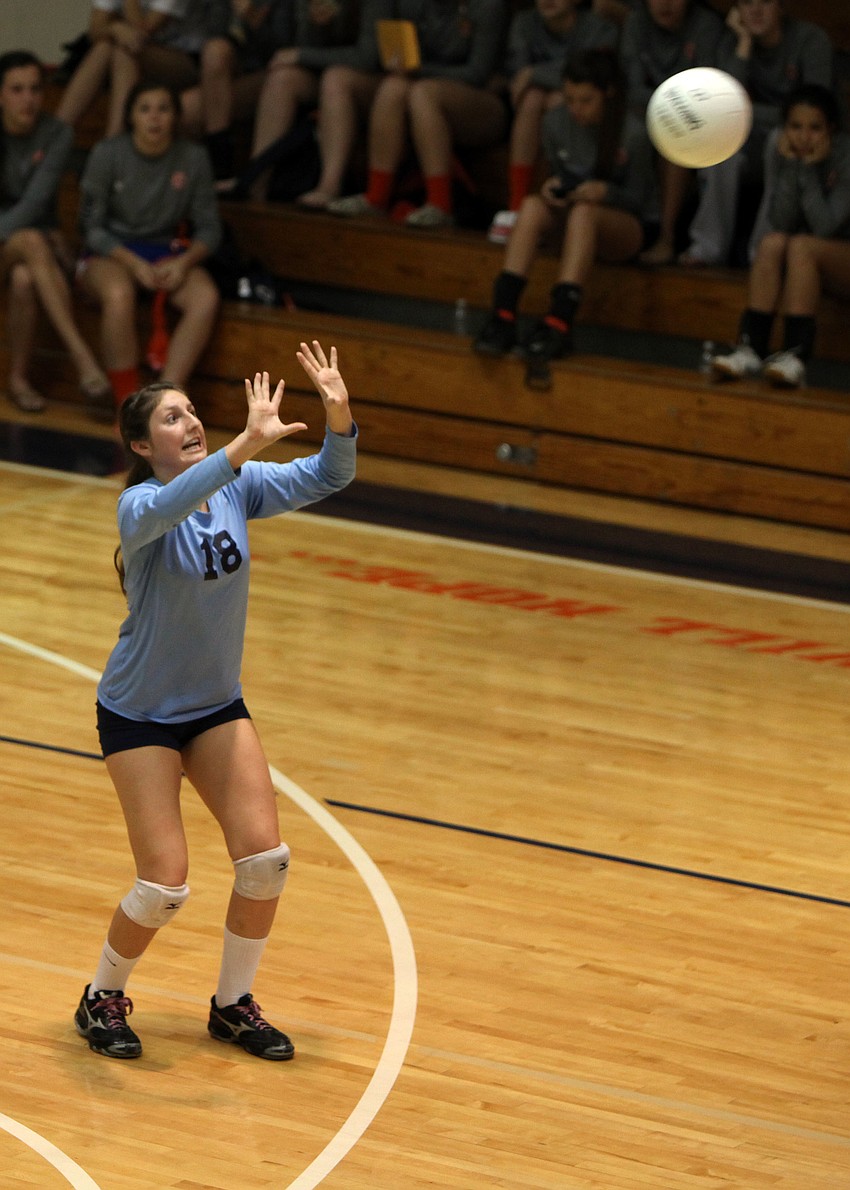 Samantha Albano, No. 18, prepares to set the ball Tuesday, Oct. 23, during the semifinal match between Cardinal Mooney High School and the Out-of-Door Academy at Bradenton Christian High School gymnasium.