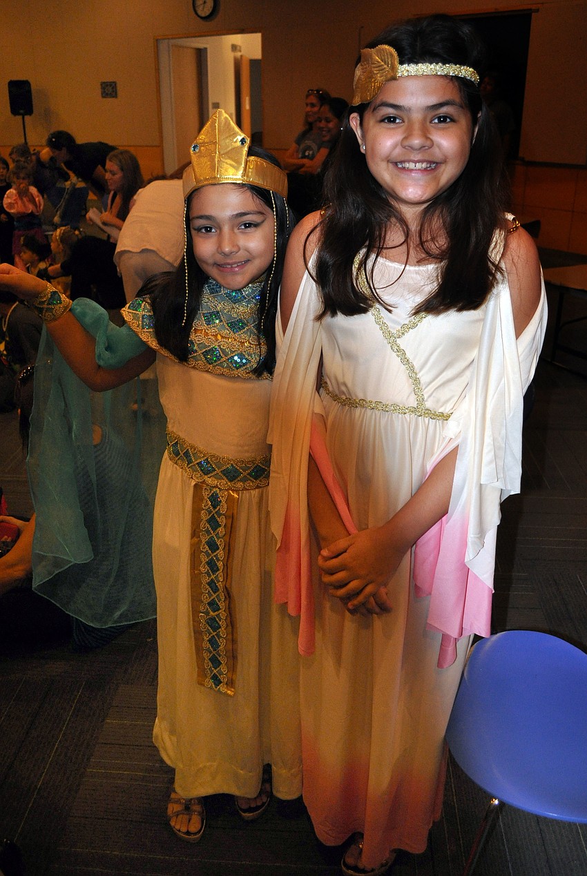 Arielle, 8, and Angel, 11, Cooper dressed up as Cleopatra and Athena.