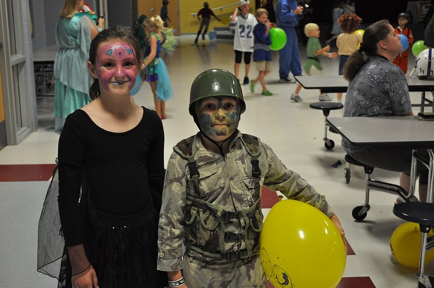 Siblings Rylan Walker and Jace Walker chased a balloon at the Character Dance.