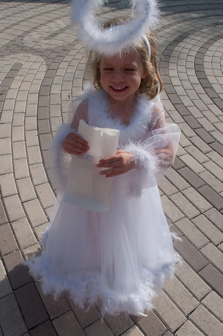Sofie Bonacuse dressed as an angel for the parade.