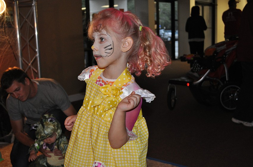 Lilli Budenhorn grooved to the music played by Mike Wilder, the childrenâ€™s pastor at Woodland.