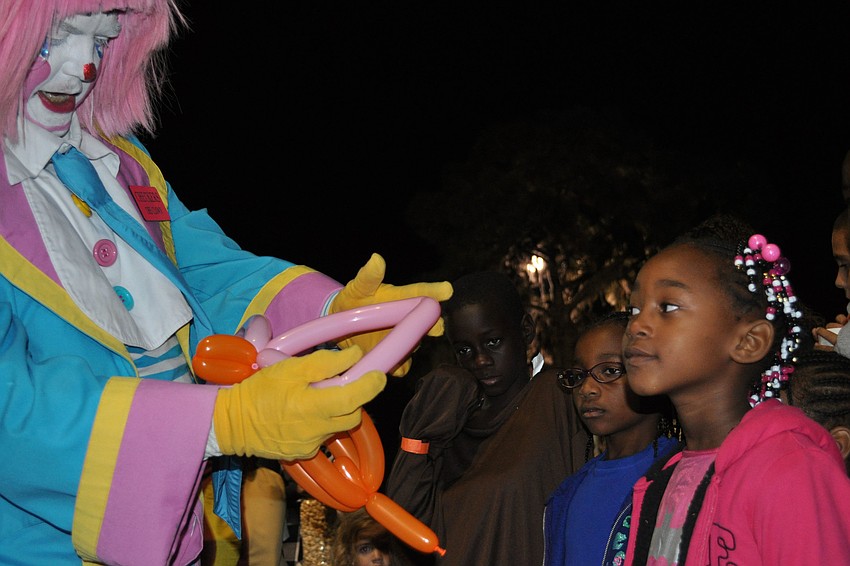 Jayla Douglas awaited her balloon creation.