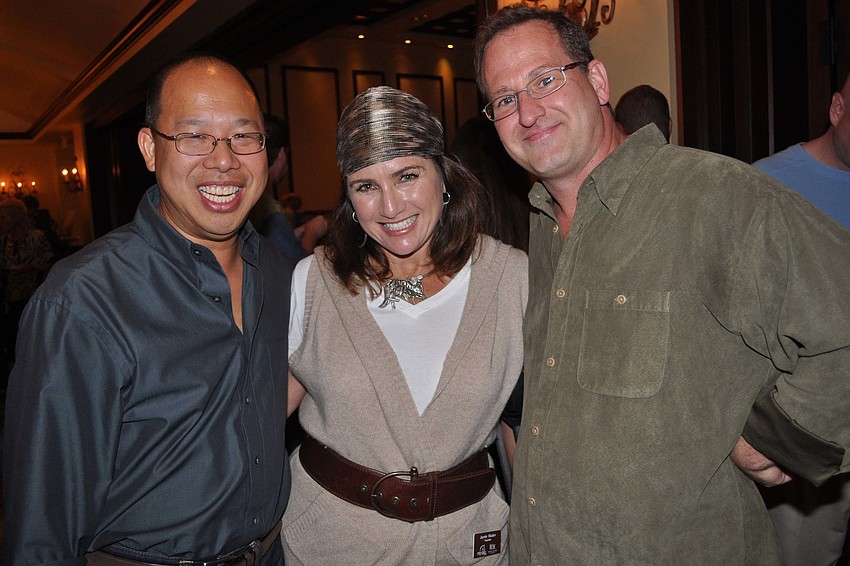 Filic Chung and Chip Nemec, with Polo Grill and Bar owner Jaymie Klauber, center.