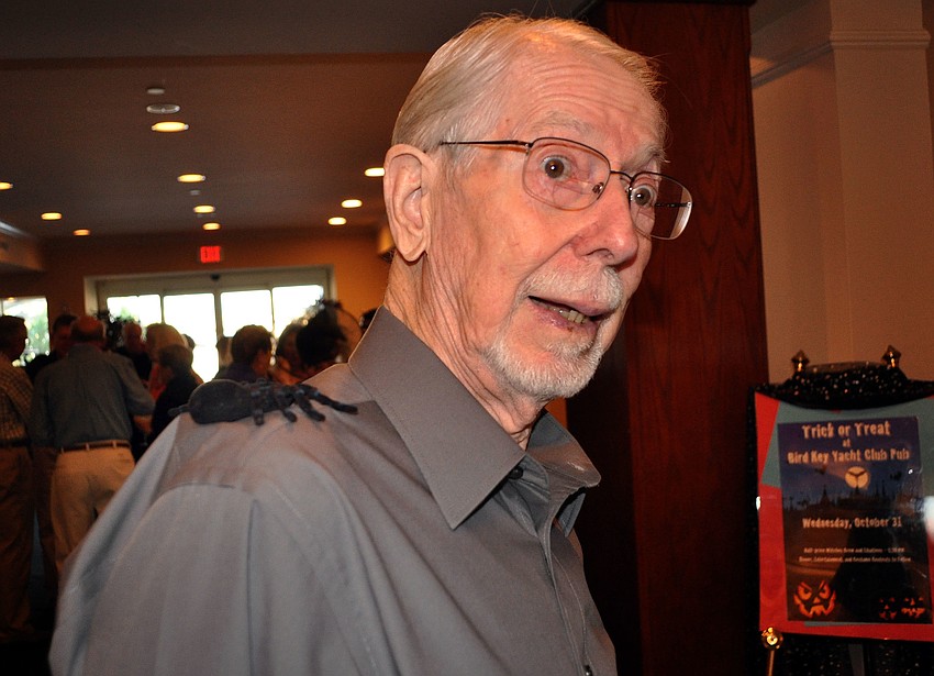 Bill Bamberg reacts to the spider on his shoulder Wednesday, Oct. 31, at Bird Key Yacht Club.