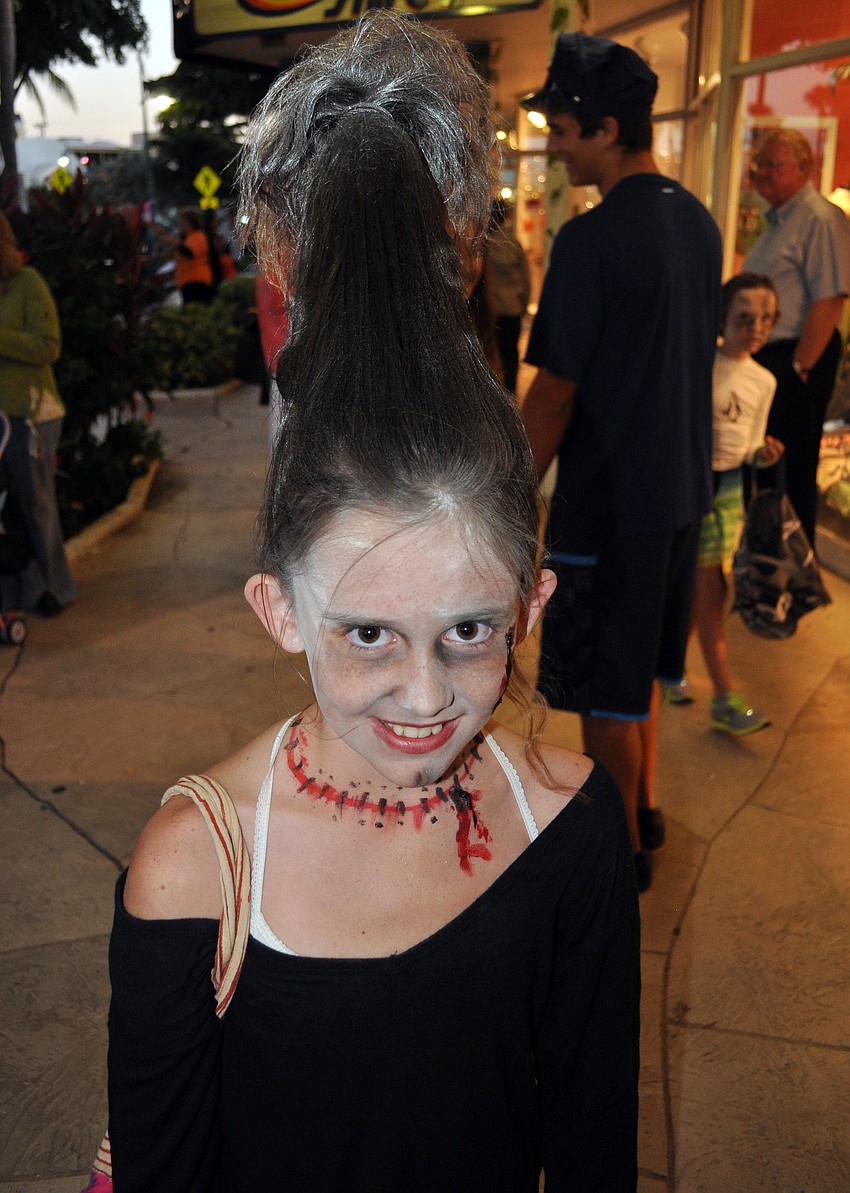 Allie Carr, 10, used a water bottle to get her hair to stand up on top of her head.