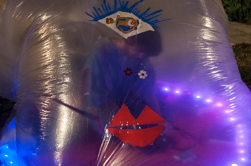 Sarah Valdez listens to recordings for her visual poetry piece.