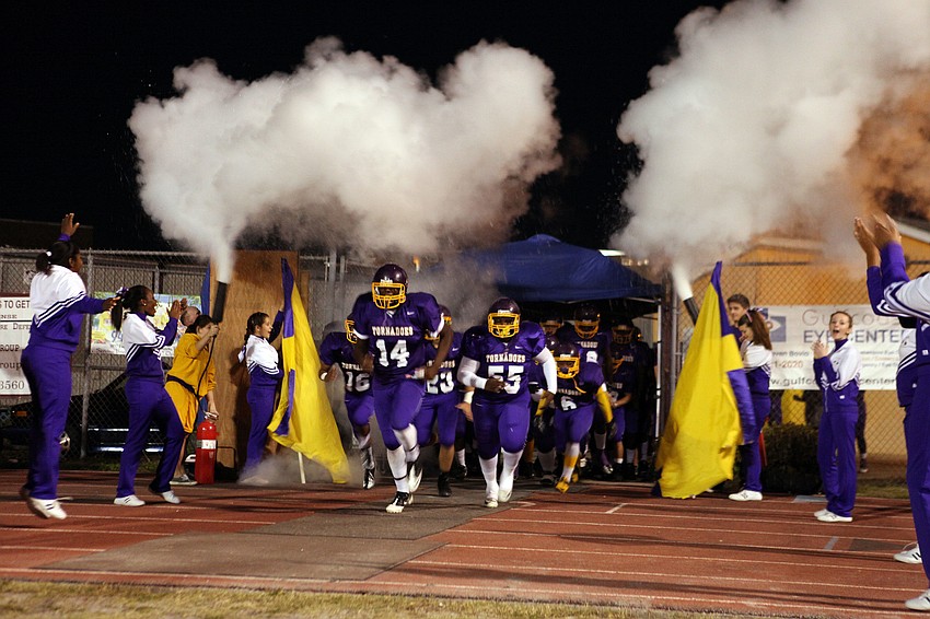 The Tornadoes make their way out onto the field Friday, Nov. 2, at Booker High School.