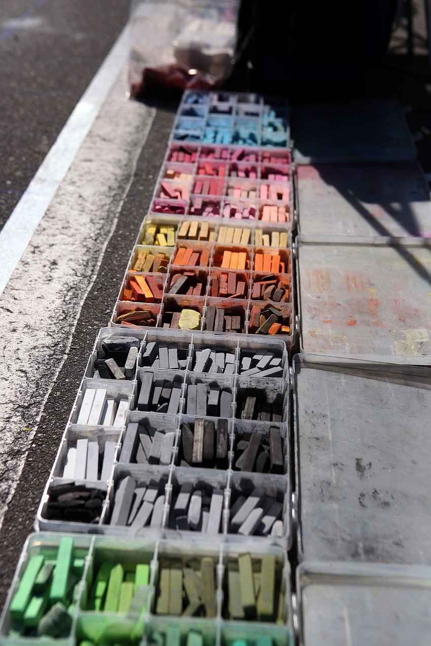 Boxes full of different colored chalk.