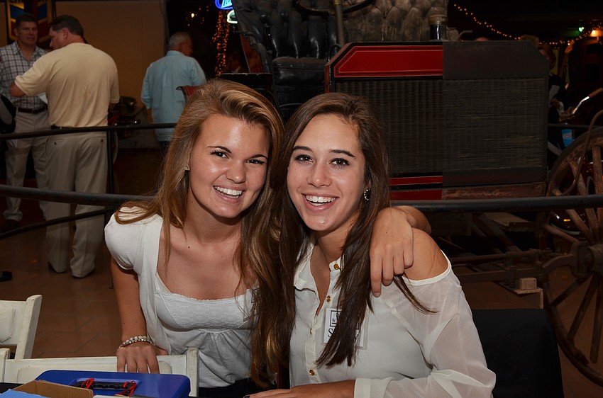 Ansley Saba and Sydney Ralph check people in at Cars Under the Stars.