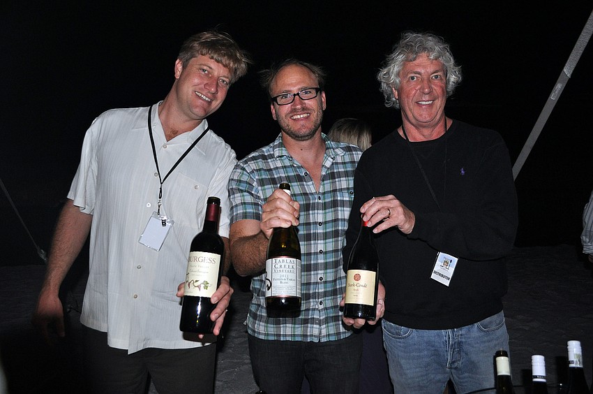 Steve Burgess, Darren Delmore and Freddy Matson show off their wines Saturday, Nov. 10, during Bacchus on the Beach and the Longboat Key Club and Resort.
