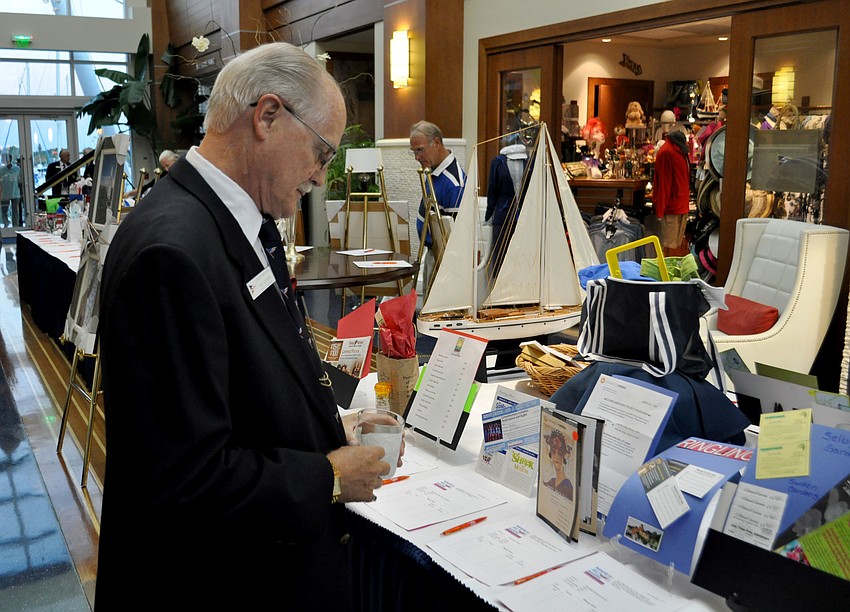 Phil Couture looks at raffle items.