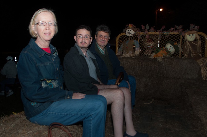 Vince Amoroso takes a hayride with his son Michael Amoroso and wife Tams Milton.