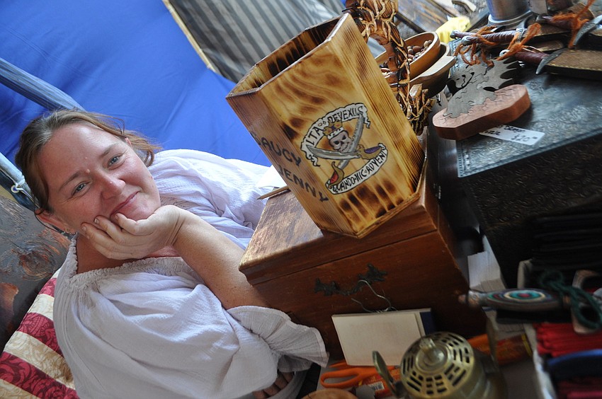 Jennifer Cocca sells trinkets and trappings, many of which her husband Marcel makes.