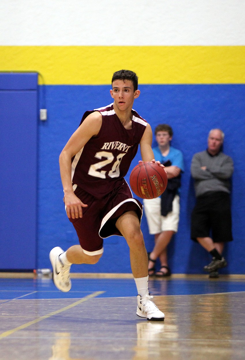 Riverviewâ€™s Josh Beychock, No. 20, makes his way down the court with the ball Tuesday, Nov. 20, during the game between Riverview and Sarasota Christian at Sarasota Christian.