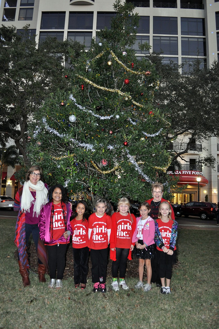 Wendy Getchell, far left, and Bonnie Kritzmacher, far right, of the Sarasota Downtown Merchants Association with Rheann Stephens, 8, Sophia Bouazzaoui, 6, Katie Soshnikova, 6, Lili Burrow, 7, Kayla Maloy, 7, and Shayla White, 7 of Girls Inc.