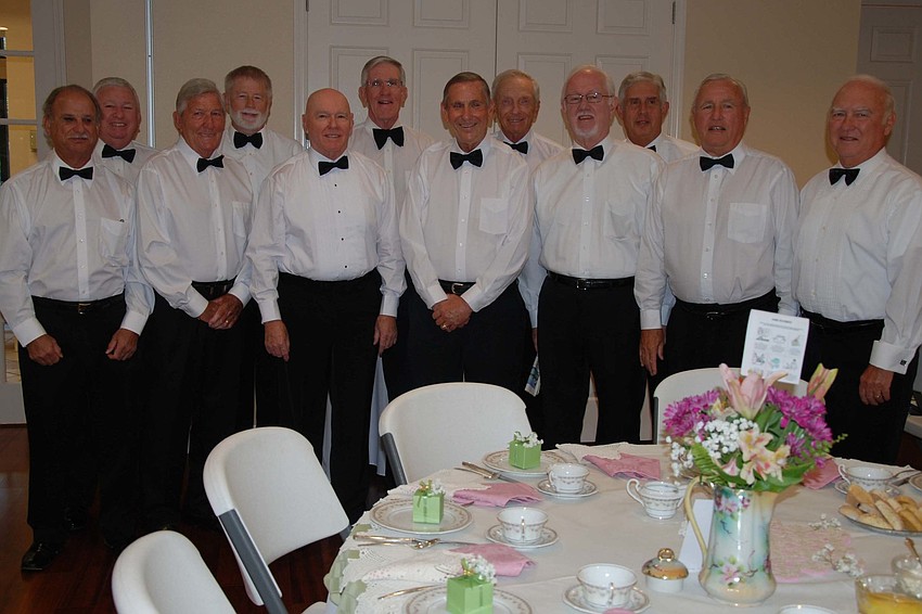 The gentlemen served tea and escorted the guests to their tables