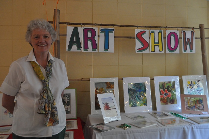 Jane Aguilard drew paintings with the watercolor group for the art show.