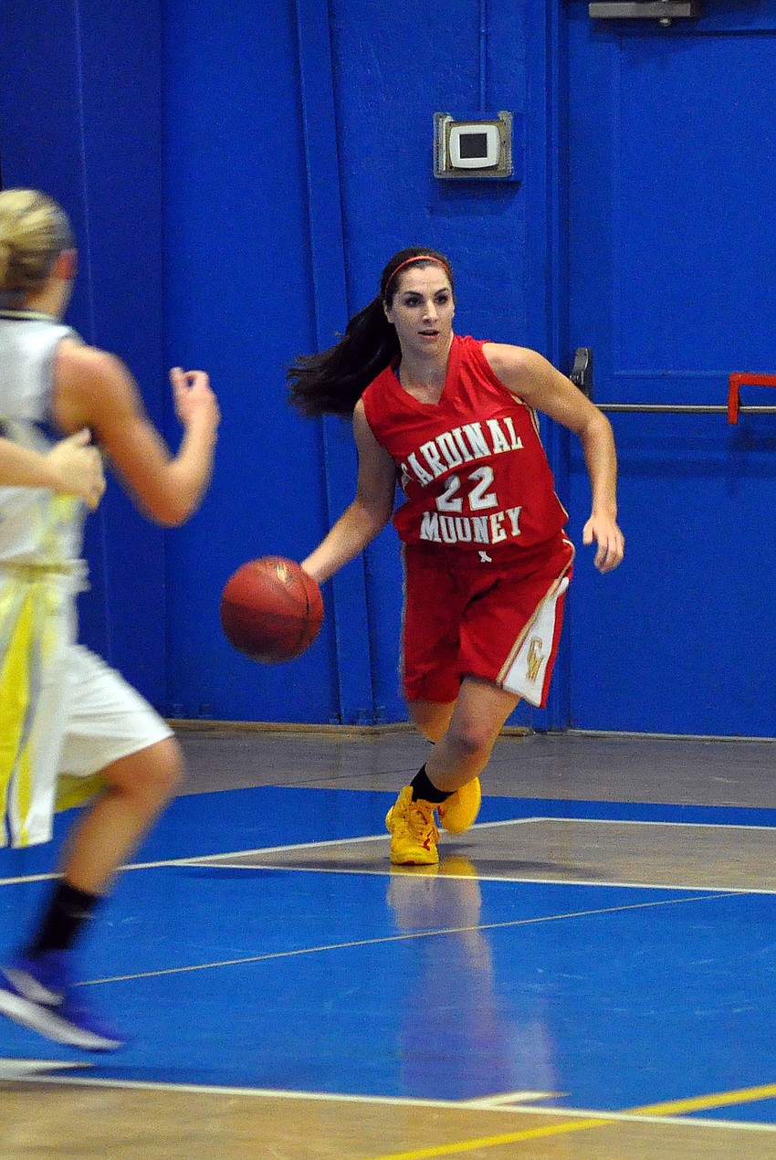 Cardinal Mooneyâ€™s Camille Giardina, No. 22, takes possession of the ball and begins to dribble it back down the court.