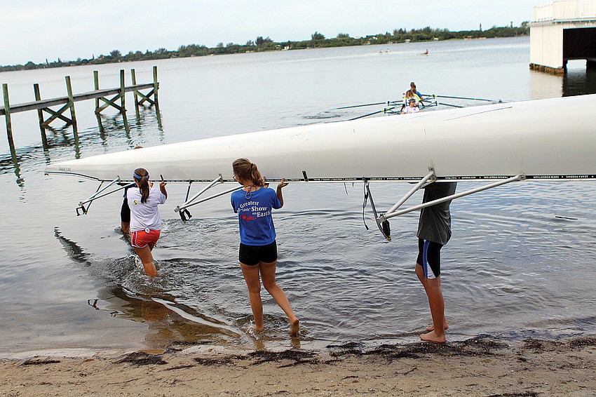 Sarasota Crew campers and counselors head out into the bay to demonstrate the rowing skills they learned on land in the water at Bay Preserve.