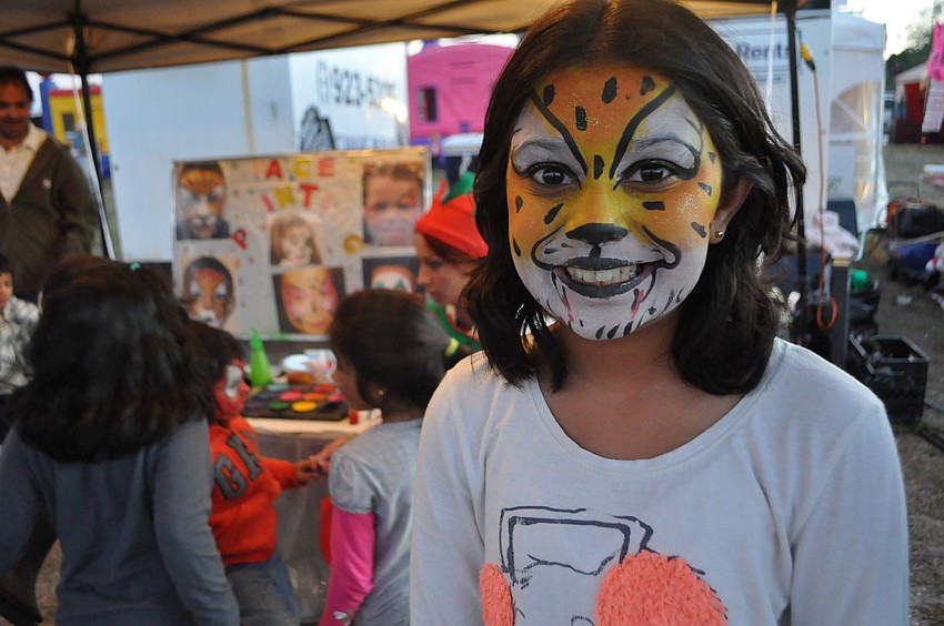 Ashley Patel, 11, got her face painted at the Snow Fest Sarasota.
