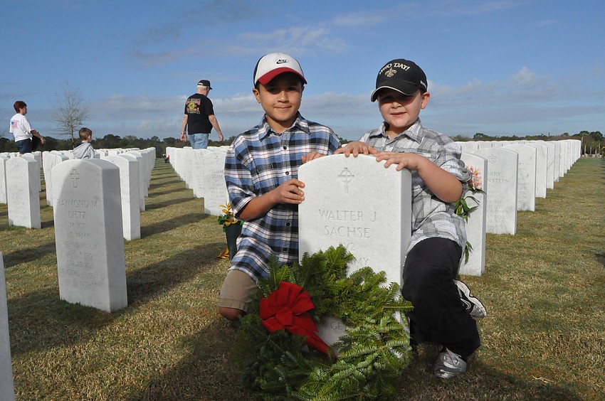 Andre Alfaro and Dominic Bowman placed a wreath on Walter Sachseâ€™s grave, their grandfather, a Vietnam War Veteran.