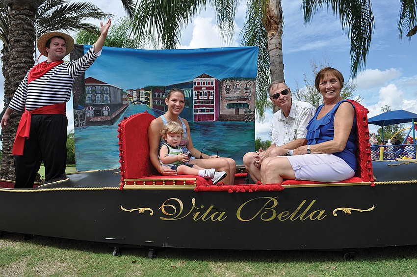 Robin Quinten and her son, Mason, get a family picture with Robinâ€™s parents, Robin and Rosalie Jones, during Festa Italia Oct.6. Published Oct. 11, 2012.